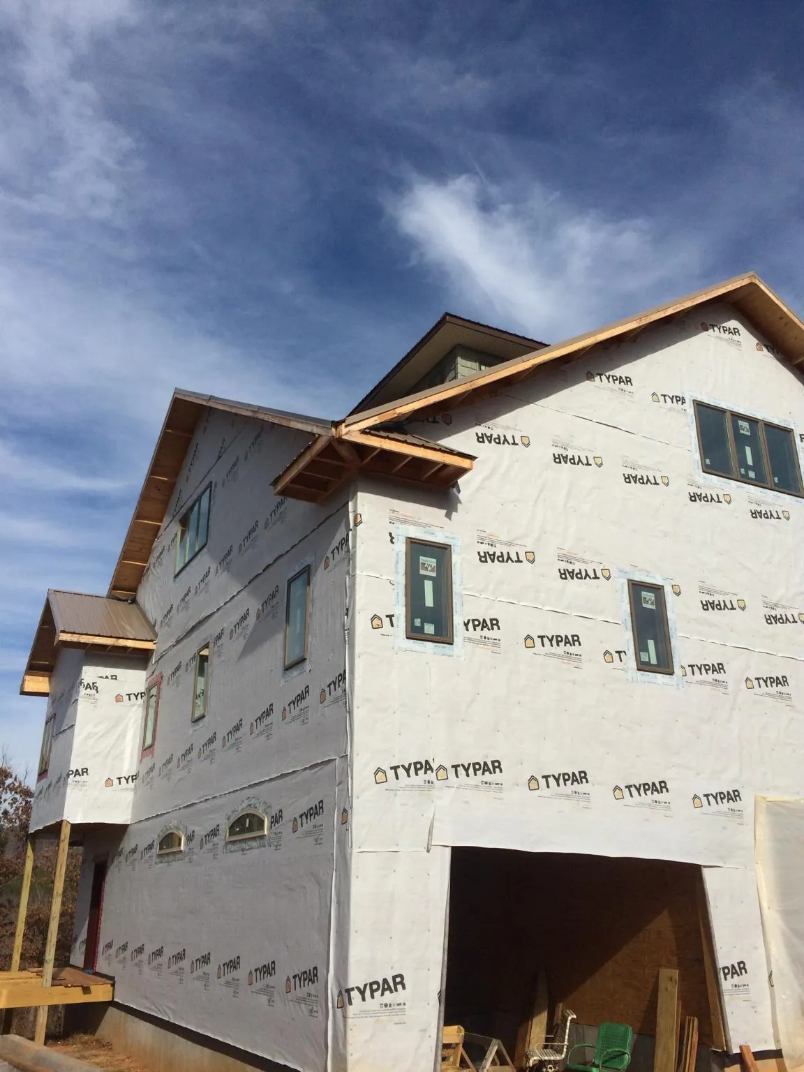 Stick built house wrapped in Typar with new roof framing and dormers in Rochester